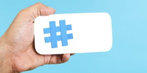 paper hashtag in hand