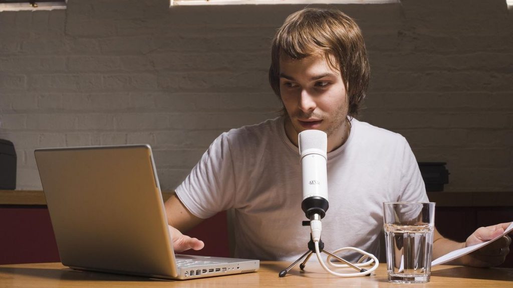 podcaster with laptop